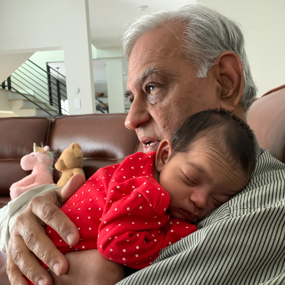 Avni snuggling with my dad