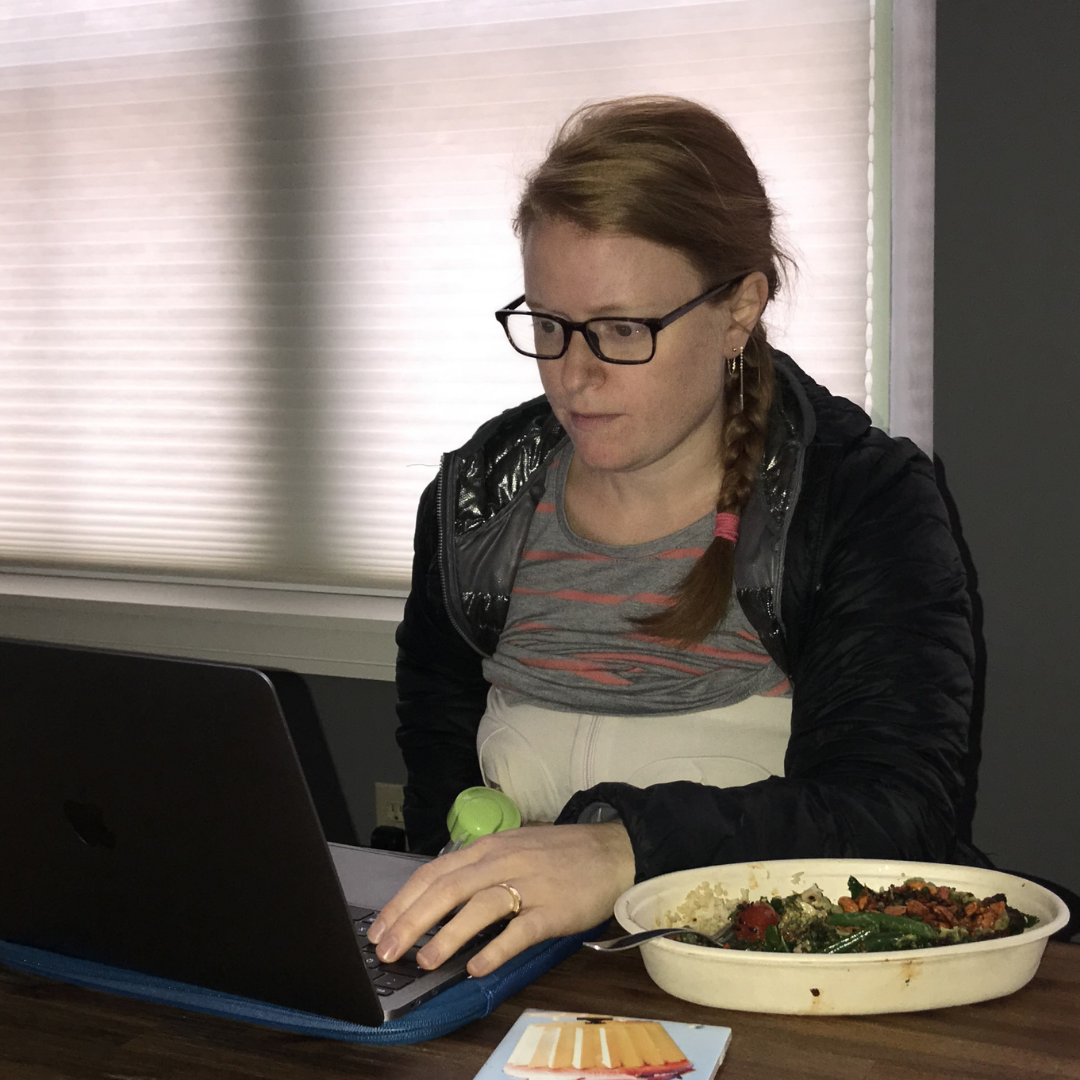 working mom at a laptop with food pumping breastmilk